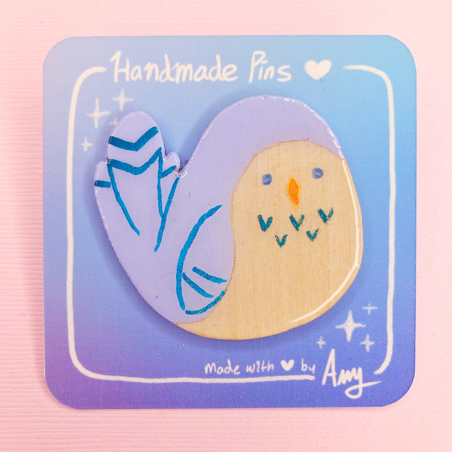 A Cute Handmade Round Boi Bluebird Wooden Pin with Hard Resin Enamel